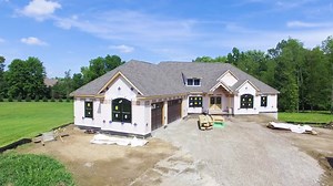 Watch as homeowner, Bethany, gives you the grand tour, taking you through each room, of her custom Litchfield under construction! From the angled garage, black windows, and double front doors at the exterior to the interior with 9' ceilings on the first floor, spacious great room, and kitchen, owner's room, covered patio at the rear, and much more! Learn all about building a Litchfield of your own here: https://bit.ly/2xwrYy7 | Wayne Homes