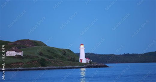 Historic McNabs Island Lighthouse in Halifax Harbour viewed from the Halifax Waterfront, Nova Scotia, Canada