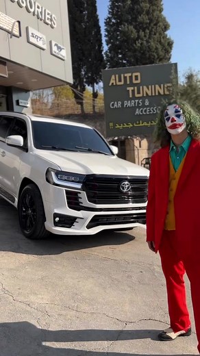 Comedic Car Dealership Antics in Red Suit