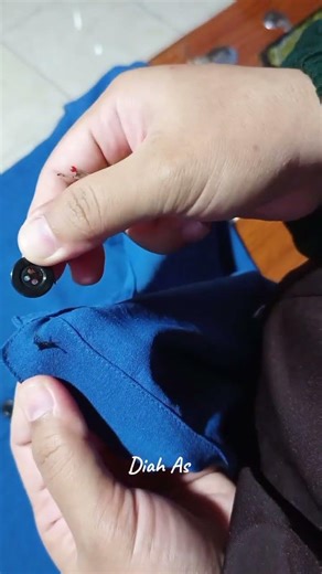 replace and install the buttons on a woman's blouse that have come loose #sewing #clothing #fashion