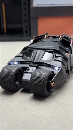 The Dark Knight Batmobile, officially licensed, features spray-drenched taillights, operable doors