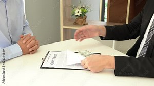 4k video of bribe and corruption concept, Corrupted businessman sealing the deal hand receiving venality bribe money from partner