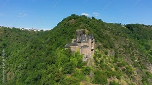 Katz castle and romantic Rhine in summer at sunset, Germany. Katz Castle or Burg Katz is a castle ruin above the St. Goarshausen town in Rhineland-Palatinate region, Germany
