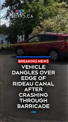 Vehicle crashes through fence and dangles over Rideau Canal