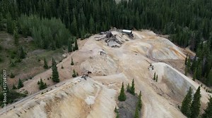 Aerial view Descending shot, Approaching an Abandoned gravel plant on the top of mountain in Uncompahgre National Forest In Colorado.