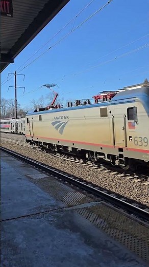 Amtrak ACS-64 #665 blows by while NJ Transit ALP-46 #4649 departs Metropark train station