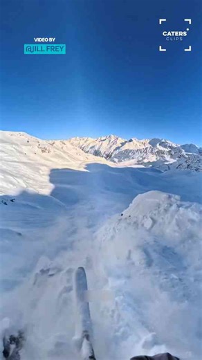 Avalanche erupts beneath skier during mountain descent