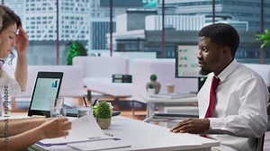 Candidate with chronic impairment attending a job interview in disability friendly office, discussing with the HR team about career development. Equal chances of employment. Camera A.