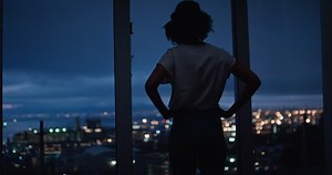 clip-1028741195-young-woman-looking-out-window-enjoying-view