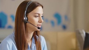 Customer support operator close up portrait. call center smiling operator with phone headset.