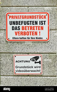 No Trespassing and Video Surveillance Signs at a Property Entrance Stock Photo - Alamy