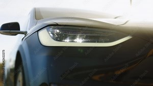 Car Front Full Led Matrice Light. Modern adaptive car headlamp flashing light with blinking on continuously indicator. Switched on led lights of luxury car. Car Blinker Light