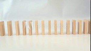 wooden dominoes lined up in a row. Side view. wooden blocks.