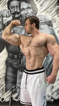 Big Russian Bodybuilder Posing and Flexing Backstage