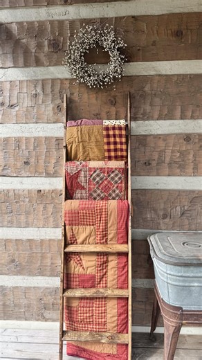 Primitive Star Quilt Shop | Layers of warm patchwork draped over a rustic quilt ladder, rich primitive tones, and a simple wreath resting above it all… it’s the little... | Instagram