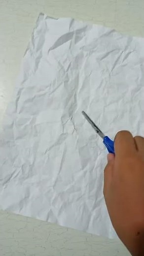 How to fix crumpled paper using scissor