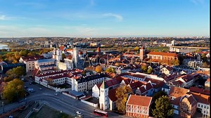 Kaunas old town panorama, Lithuania. 4K aerial view footage of Kaunas city center with many old red roof houses, churches. Drone video