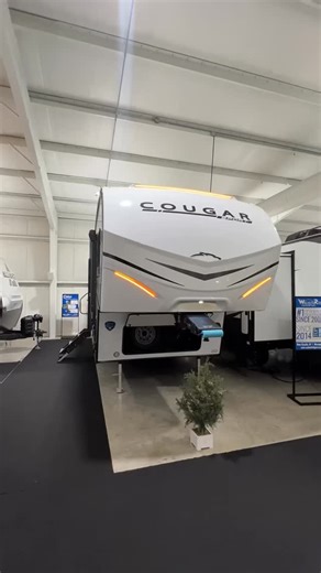 The 2025 Keystone Cougar Sport 2400RE ￼packs BIG features into a lightweight fifth wheel. Hidden storage, theater seating, and a cozy queen bed. #rvwalkthrough #campingseason #rvliving #rvadventures #couplescamper | Walnut Ridge RV