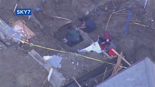 A car found buried in a California backyard is being checked for possible human remains, police say