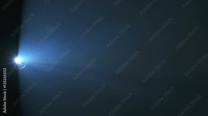 The very bright projector light with a dust particle flow. Real time capture