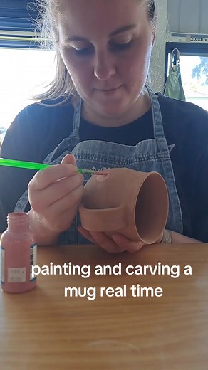 painting and carving a mug (well, 4 mugs) with a native flower inspired design. these flowers match the ones on the vase I made 2 weeks ago. and the other mugs I made have matching leaves. I'm enjoying designing this collection and al the new things I'm trying now I have time to create, rather than pump out pots for my old shop. #potterytiktok #potterystudio #bairnsdale #mug #mugtok #ceramics #handmademug