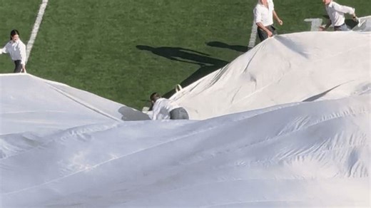 Giant Texas Flag Topples Runner at UT Game