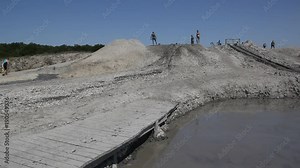 Mud volcano Shugo.People covered in volcanic mud. Shugo is located on the Taman Peninsula in Russia