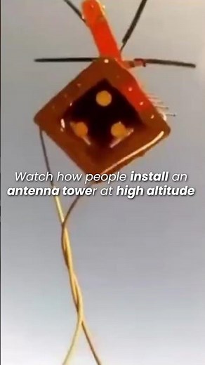 Watch how people install an antenna tower at high altitude