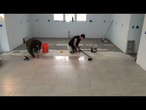 Time Lapse of setting a flat tile floor on mud.