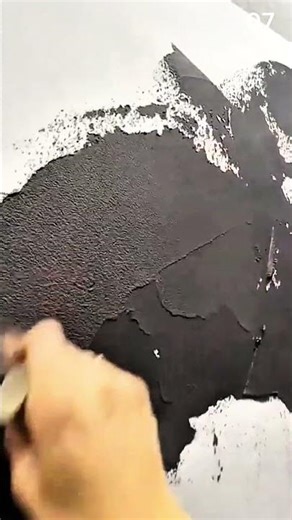 Drawing on black surface using cylindrical chalk pastelb