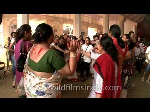 Women join young girls in Durga Puja celebration