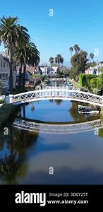 Beautiful view of Marina del Rey lagoon. Channel with ocean water. Private houses on both sides of shore. Warm Sunny Day in Los Angeles California.