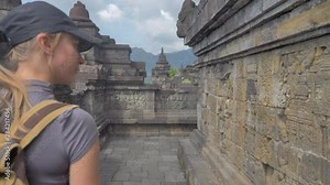 ourist backpacker exploring the Borobudur temple in Java island,Indonesia