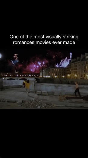 @strictlymovieclips on Instagram: "The Lovers on the Bridge (Les Amants du Pont-Neuf, 1991) feels less like a movie and more like a fever dream burned onto celluloid. Leos Carax turns Paris into a living, breathing organism, and the Pont-Neuf itself becomes a stage for obsession, desperation, and raw human need. Every frame is drenched in intensity—harsh neon lights cutting through darkness, fireworks exploding over the Seine, bodies moving like they’re fighting gravity. It’s visually overwhelmi