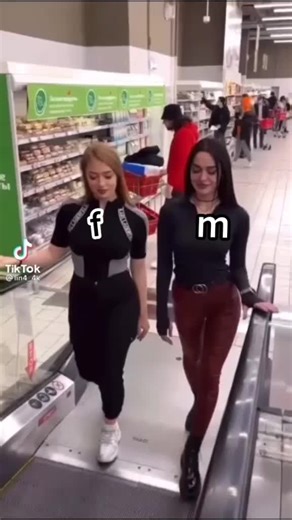 Fashionable Escalator Moments in a Supermarket