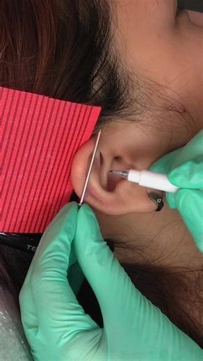 Industrial Piercing Process by Kyra Gessner