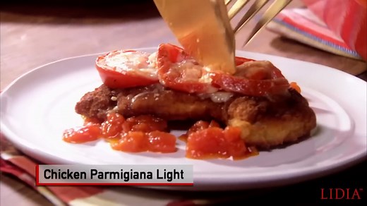 Here I'm cooking one of my all-time favorites - Chicken Parmigiana Light - a version of the famous Chicken Parmigiana made with chicken thighs topped with tomato and mozzarella and nestled in a bed of fresh tomato sauce. The thighs tend to stay moister during cooking and the flavors of this version are lighter and brighter than the traditional one - perfect for a weeknight dinner. Buon Gusto! #LidiasRecipes #LidiasItaly #LidiasKitchen #LidiaBastianich #ItalianFood #FromLidiasTableToYours #Lidias