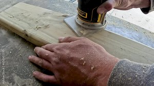 Video of carpenter using router.