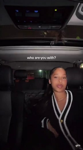 Friends Laughing in a Car at Night