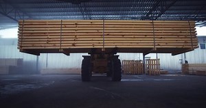 Loader work in the warehouse. Transportation of lumber, building materials.