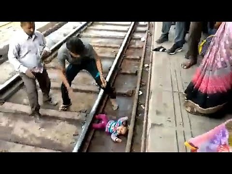 Watch: Baby in India survives after being 'run over' by train