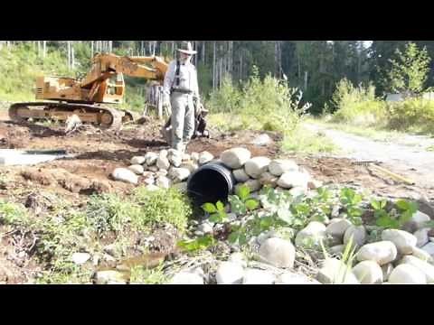 Building a Rock Headwall for Culvert in Three Minutes...