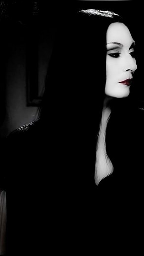 Shayla Grimsley on Instagram: "Gomez and Morticia🌹🖤 Gomez and Morticia are the epitome of passionate love and deep connection. Their devotion to one another showcases a beautiful reciprocity, where every glance and touch speaks volumes. Embracing their unique family values, they create a world filled with romance and intrigue that captivates everyone around them. Their bond is magnetic, proving that love can thrive in the most unusual of circumstances. Follow @thedarktriadshadows