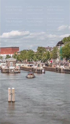 Timelapse view of boats passing through the Amstel locks on the Amstel River. Amsterdam, Netherlands