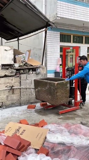 Operating a forklift to lift a piece of equipment and heavy metal objects that are difficult to move