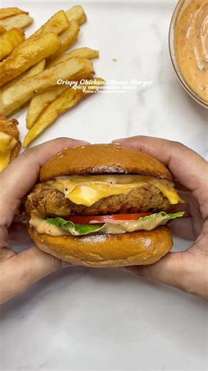 Chicken Cheese Burger Recipe INGREDIENTS For the Chicken Marinade: Chicken breast fillets – 2 pieces (about 150–180 g each) Buttermilk – 1 cup (240 ml) Salt – ½ tsp Black pepper – ½ tsp Red chili powder – 1 tsp Garlic powder – ½ tsp Onion powder – ½ tsp For the Coating: All-purpose flour – 1 cup (125 g) Cornflour (cornstarch) – ¼ cup (30 g) Salt – ½ tsp Black pepper – ½ tsp Garlic powder – ½ tsp Chili flakes – ½ tsp A few tablespoons of the used marinated buttermilk (about 2–3 tbsp) — to create 