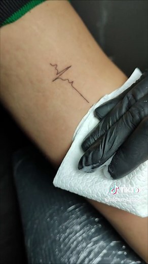 Stylish Blackwork Tattoo Design with Fineline Heartbeat and Roman Numerals