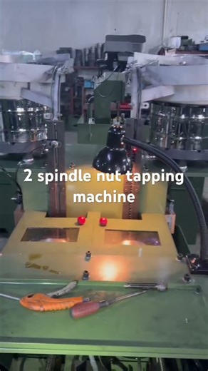 Nut tapping machine