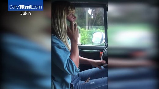 Woman screams in shock at tiny lizard on her lap