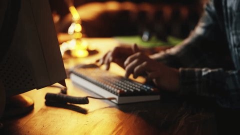 clip-4010554471-close-up-male-specialist-typing-on-computer-keyboard